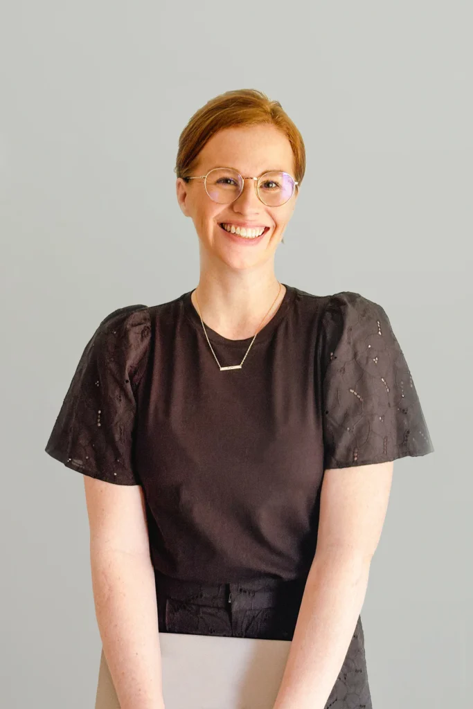 Kathleen Peralta, founder and designer of PERKA Design Co., smiling in a professional portrait.